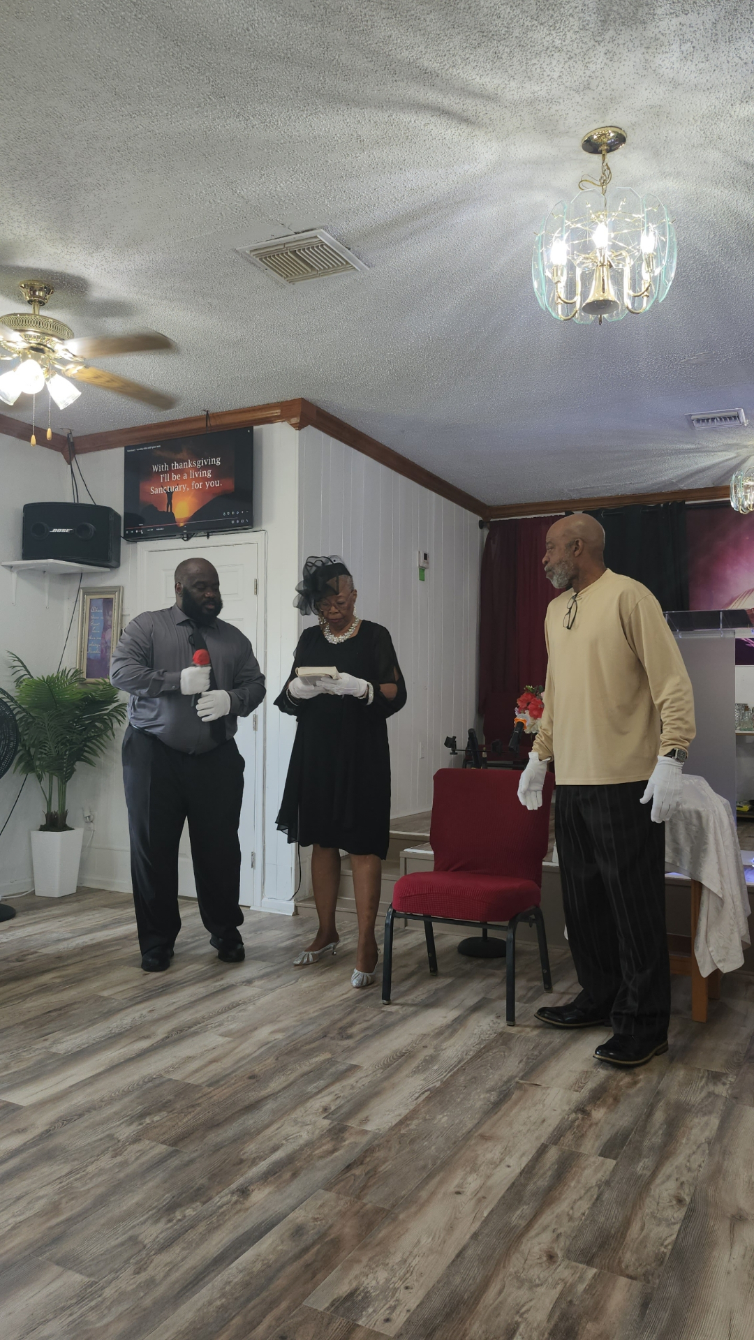Ministry leaders serving communion during worship