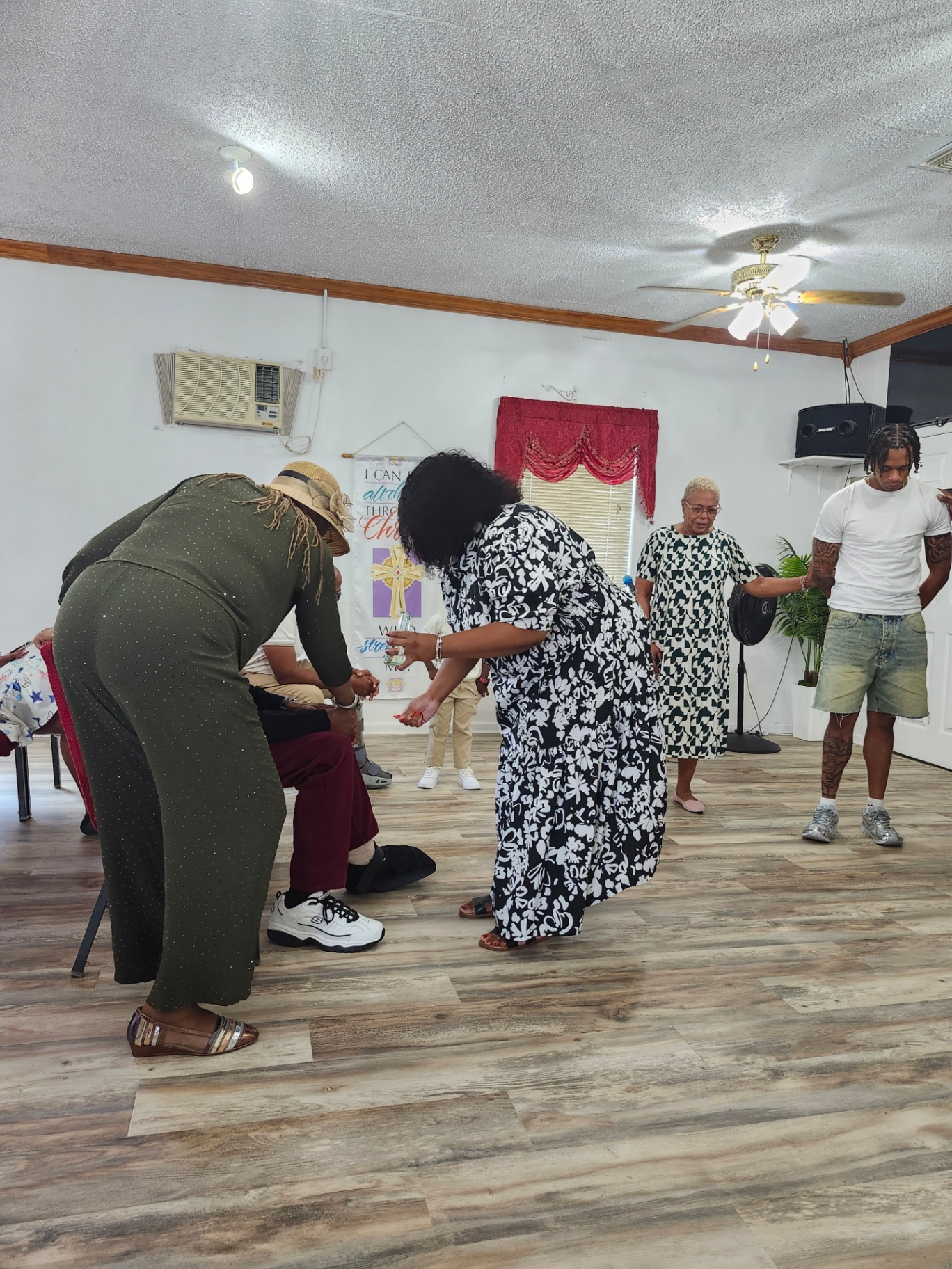 Members praying together during a Sunday service